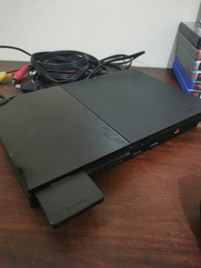 PlayStation 2 Console with Memory Card, Controllers and 7 Games