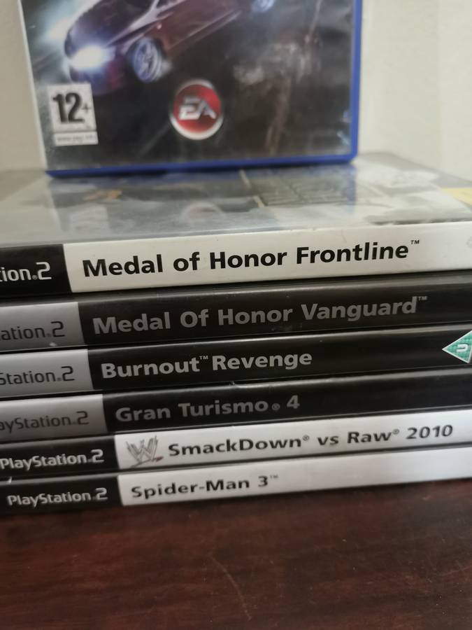 PlayStation 2 Console with Memory Card, Controllers and 7 Games