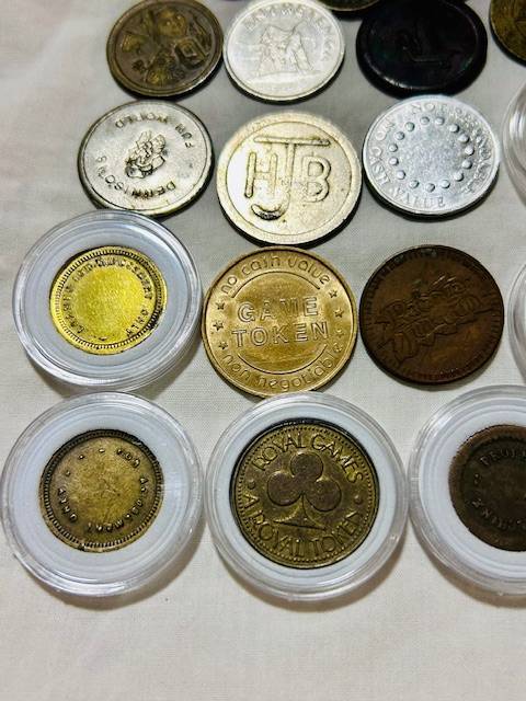 20 x Tokens all different from new to VF nice lot capsules included one bid takes all