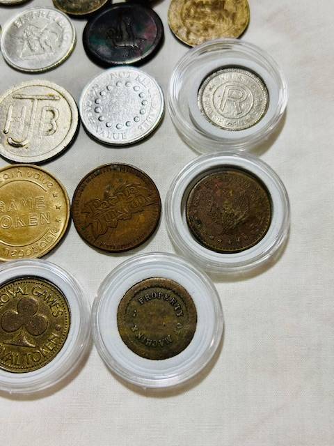 20 x Tokens all different from new to VF nice lot capsules included one bid takes all