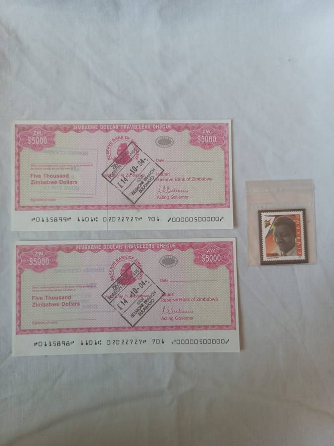Collectors Zimbabwe five thousand dollars travels cheques and a stamp