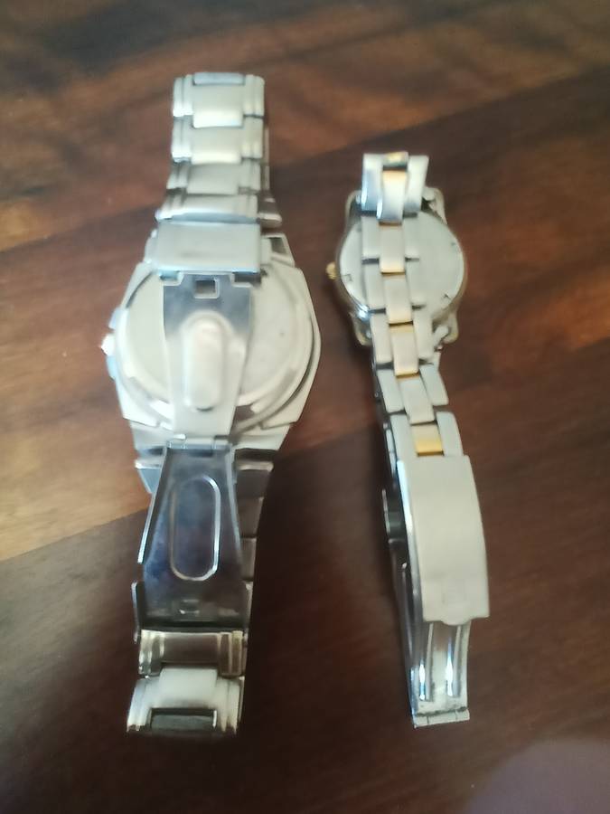 Justin men's watch and a Sandoz ladies watch