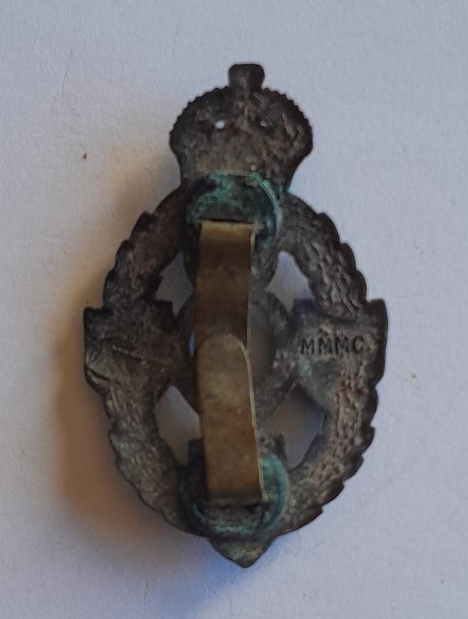 WW2 Royal Electrical Mechanical Engineers Badge.  Clasp Intact.