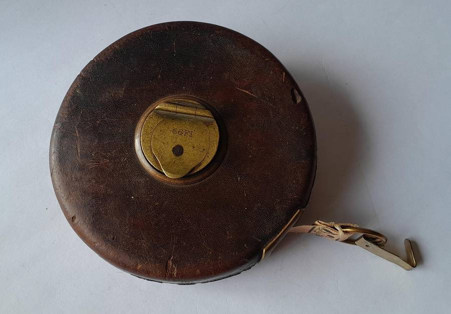 Antique Leather Cased 66ft Wind Up Measuring Tape with Brass Handle.