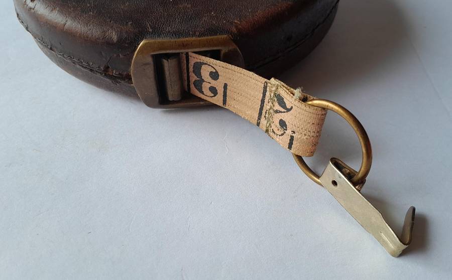Antique Leather Cased 66ft Wind Up Measuring Tape with Brass Handle.