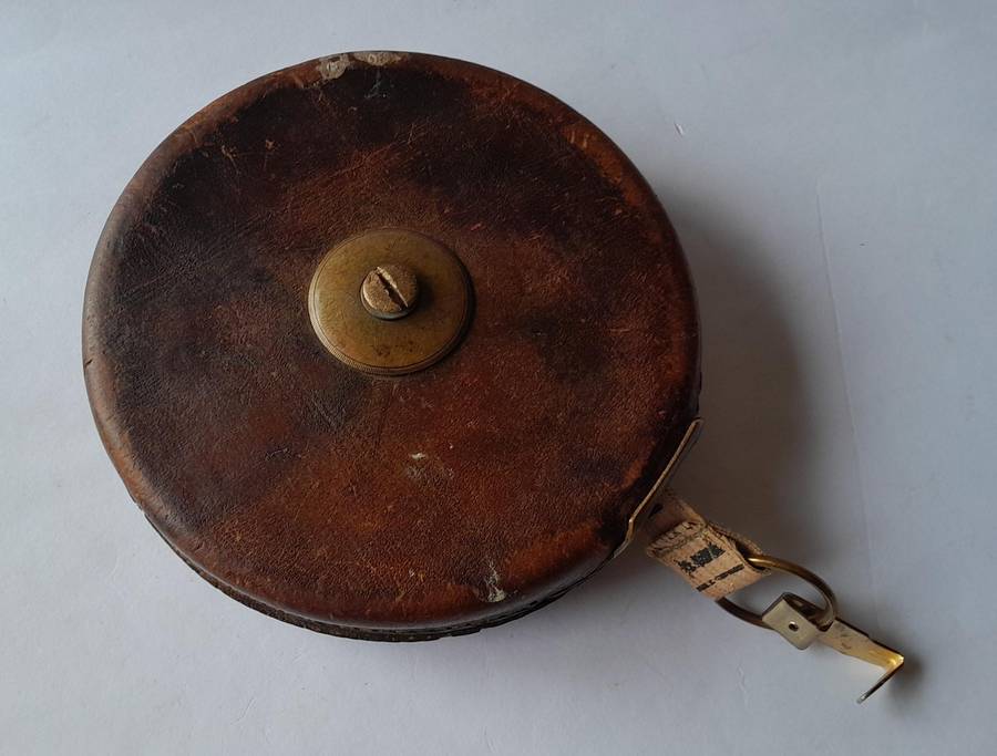 Antique Leather Cased 66ft Wind Up Measuring Tape with Brass Handle.