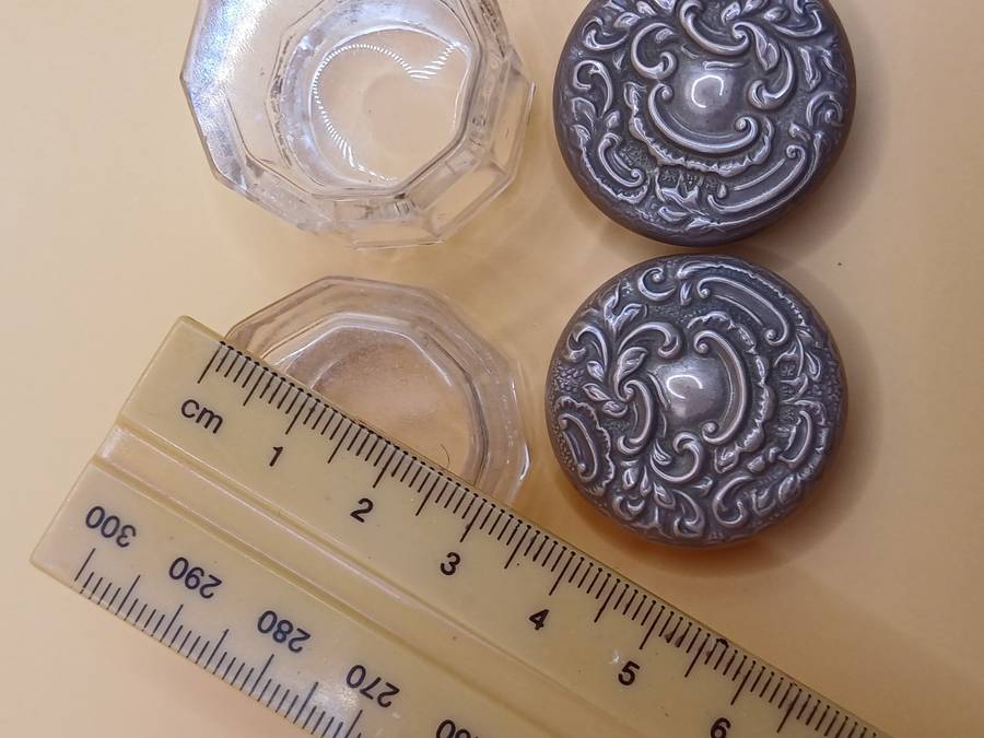 Two small marked silver and glass vanity jars lion facing left
