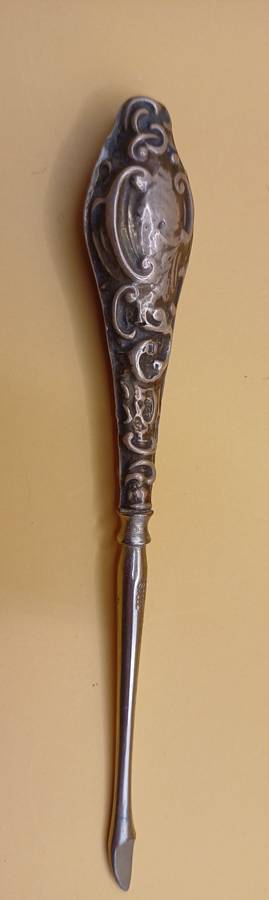 Marked silver lion facing left