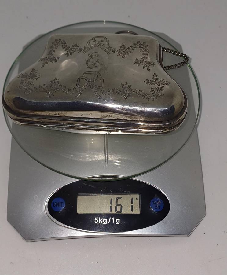 Antique silver coin purse marked with lion facing left