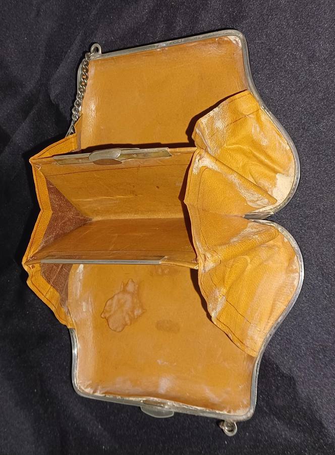 Antique silver coin purse marked with lion facing left