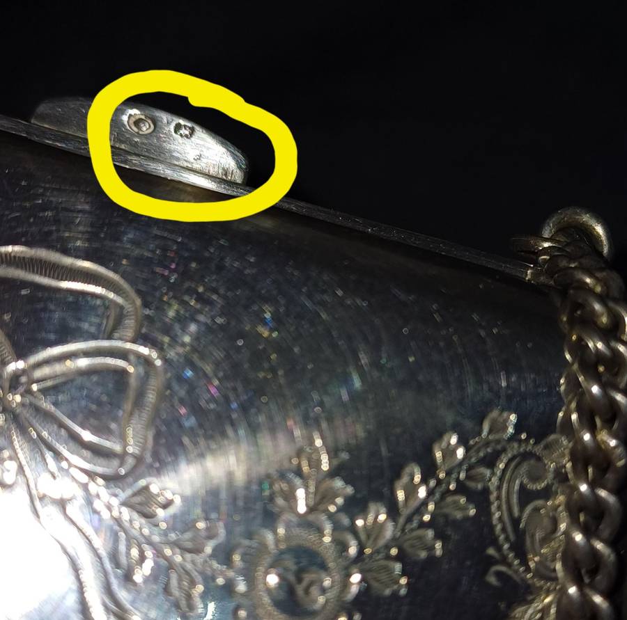 Antique silver coin purse marked with lion facing left