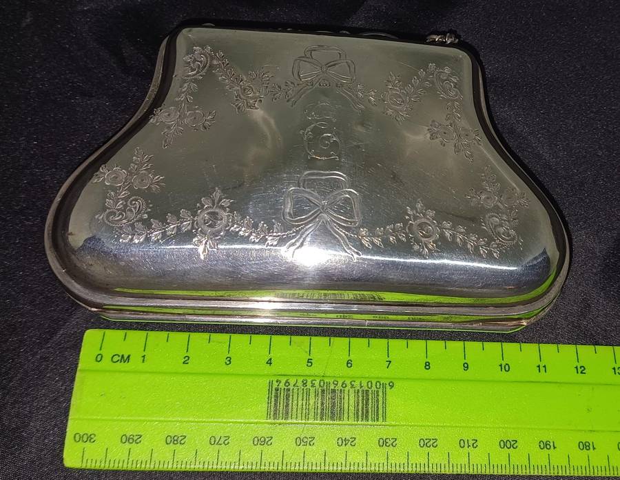Antique silver coin purse marked with lion facing left
