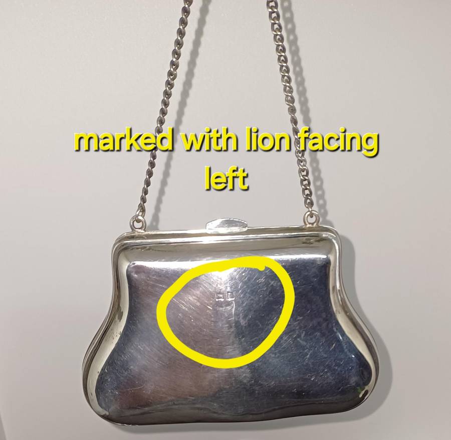 Antique silver coin purse marked with lion facing left