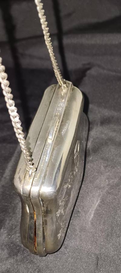 Antique silver coin purse marked with lion facing left