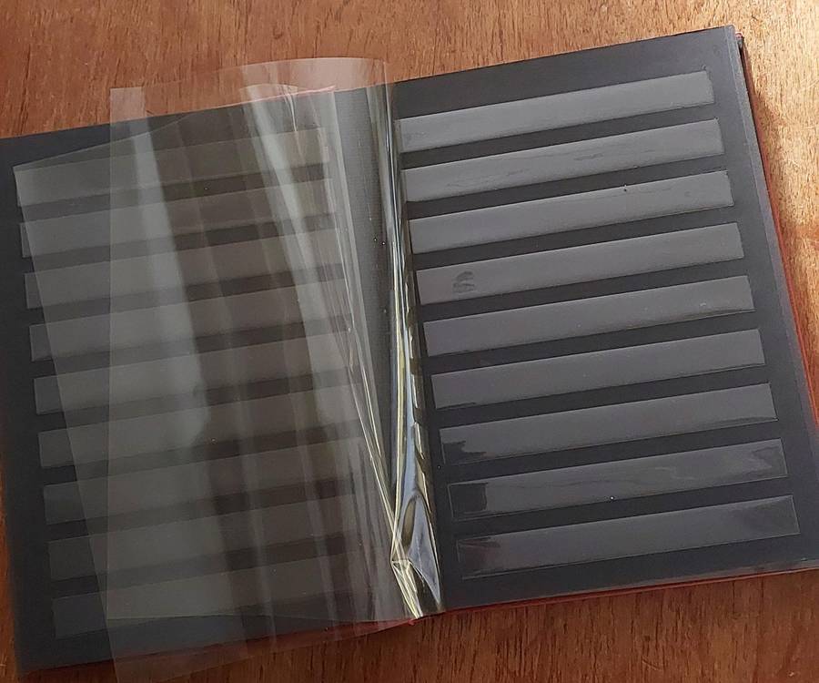 Stamp Album. Empty, 8 x d/sided black pages