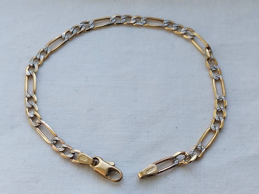 GENUINE 9 CT GOLD FIGARO-LINK BRACELET.