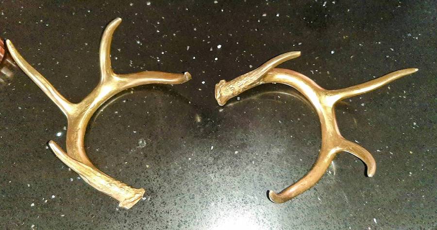 Pair of aluminum brass plated andlers.