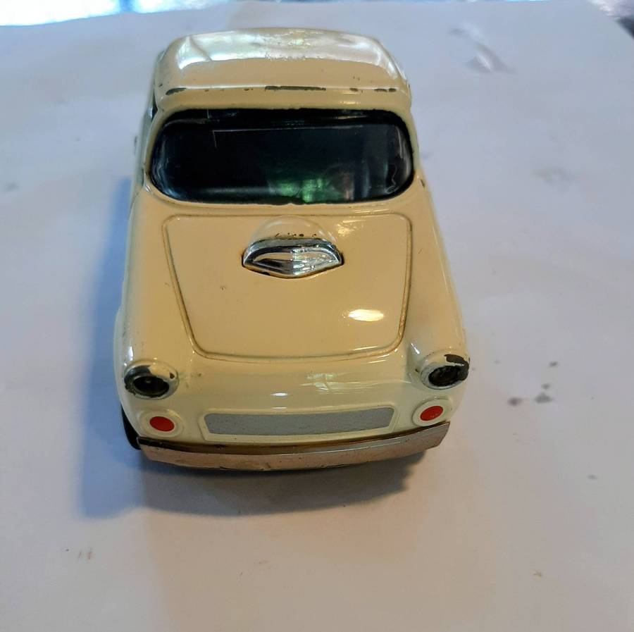 Vintage die-cast model of a 1955 Ford Thunderbird. This model is a replica.