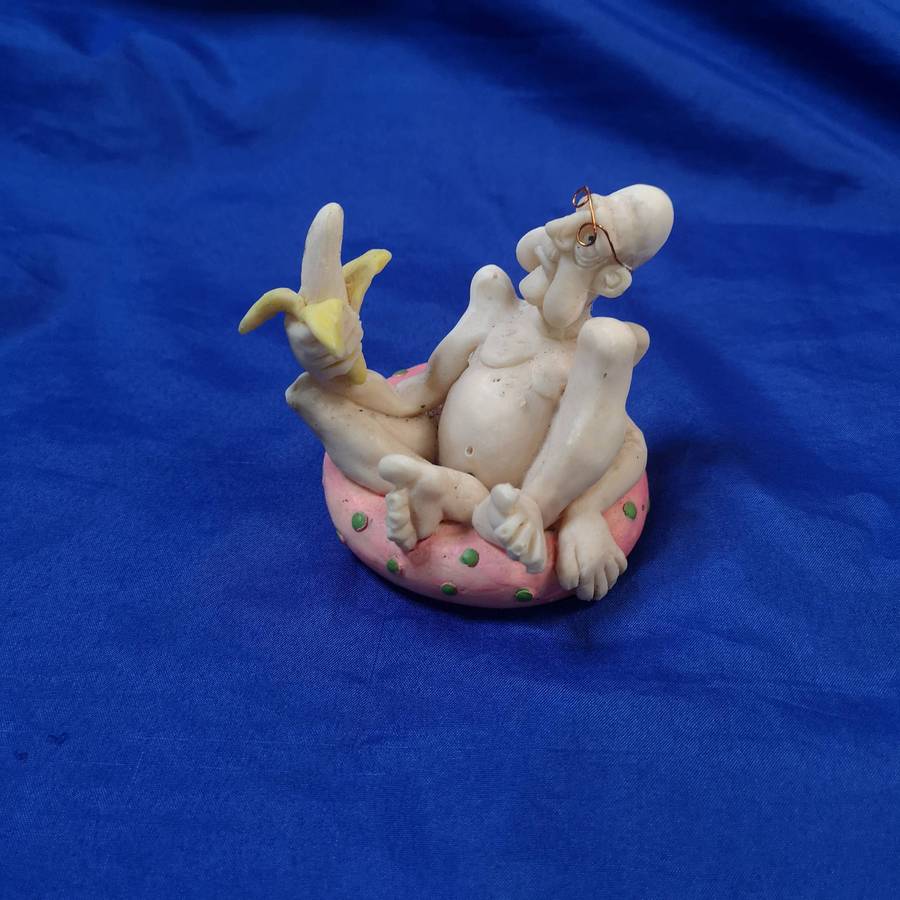 Rare Ornament. "Old Man with a Banana on a Pool Floatie"
