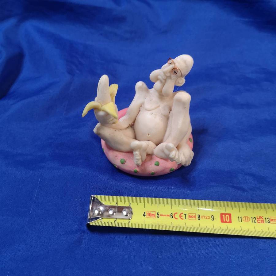 Rare Ornament. "Old Man with a Banana on a Pool Floatie"