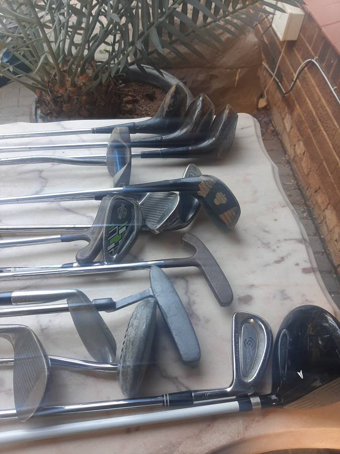 Assorted golf clubs