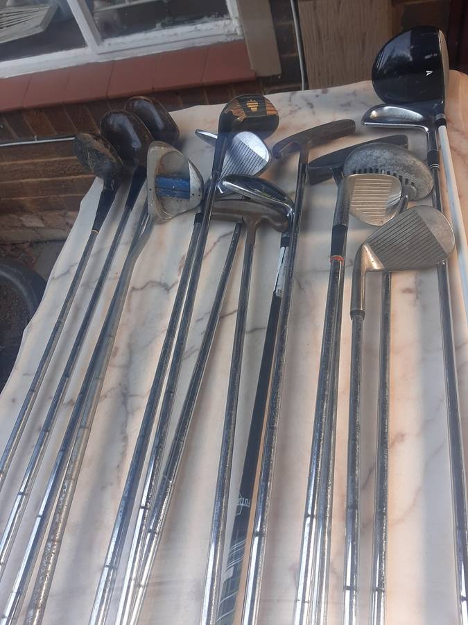Assorted golf clubs