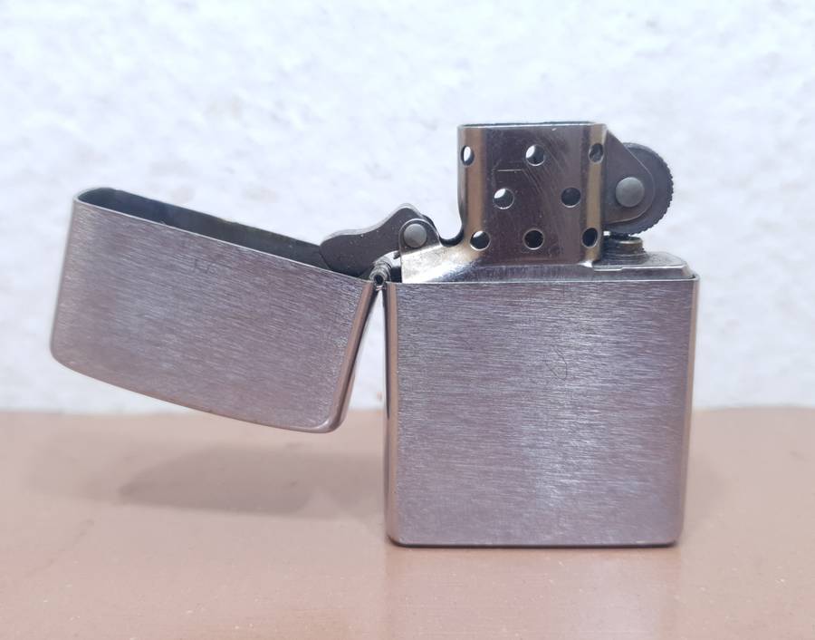 Demo stock - Authentic USA made Classic Brushed Chrome style Zippo Lighter in good condition.