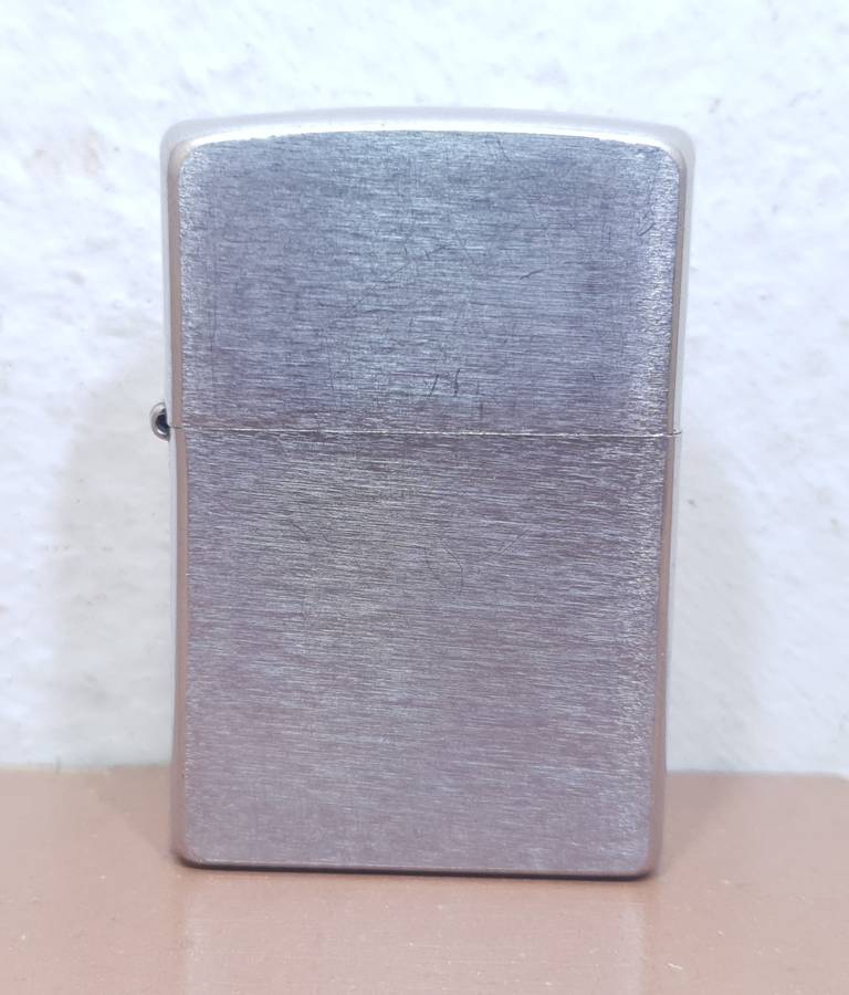 Demo stock - Authentic USA made Classic Brushed Chrome style Zippo Lighter in good condition.