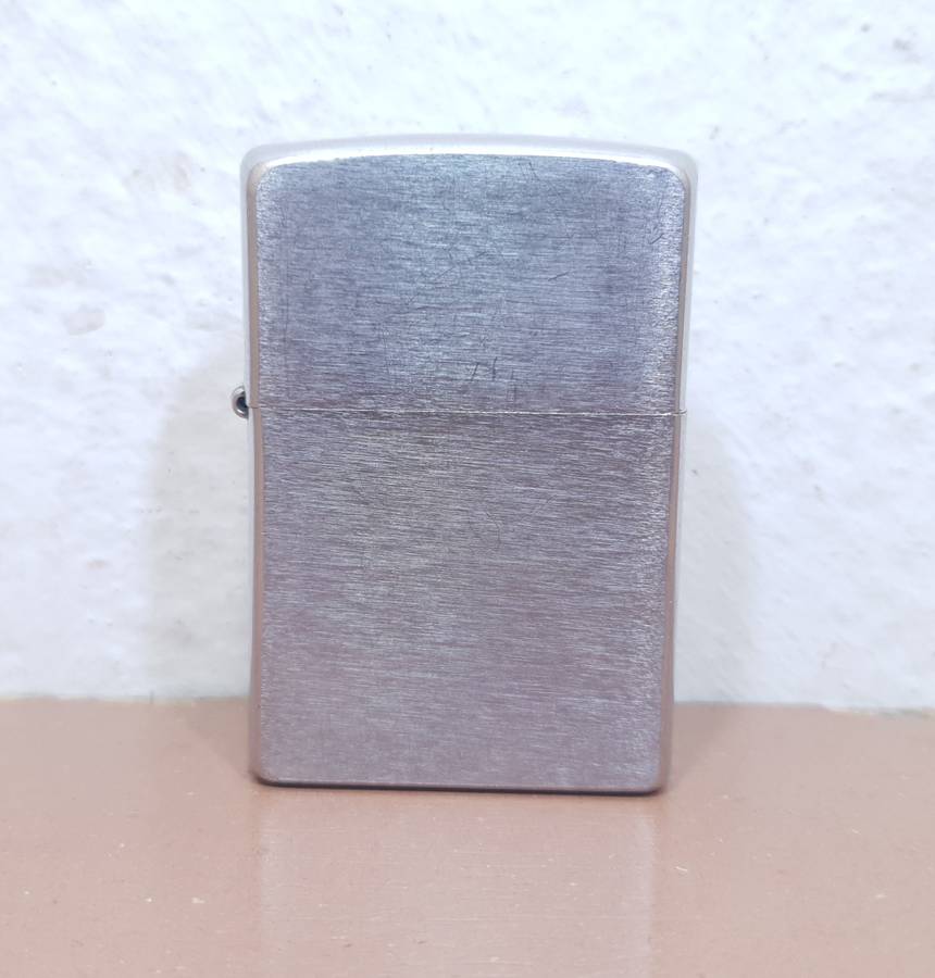 Demo stock - Authentic USA made Classic Brushed Chrome style Zippo Lighter in good condition.