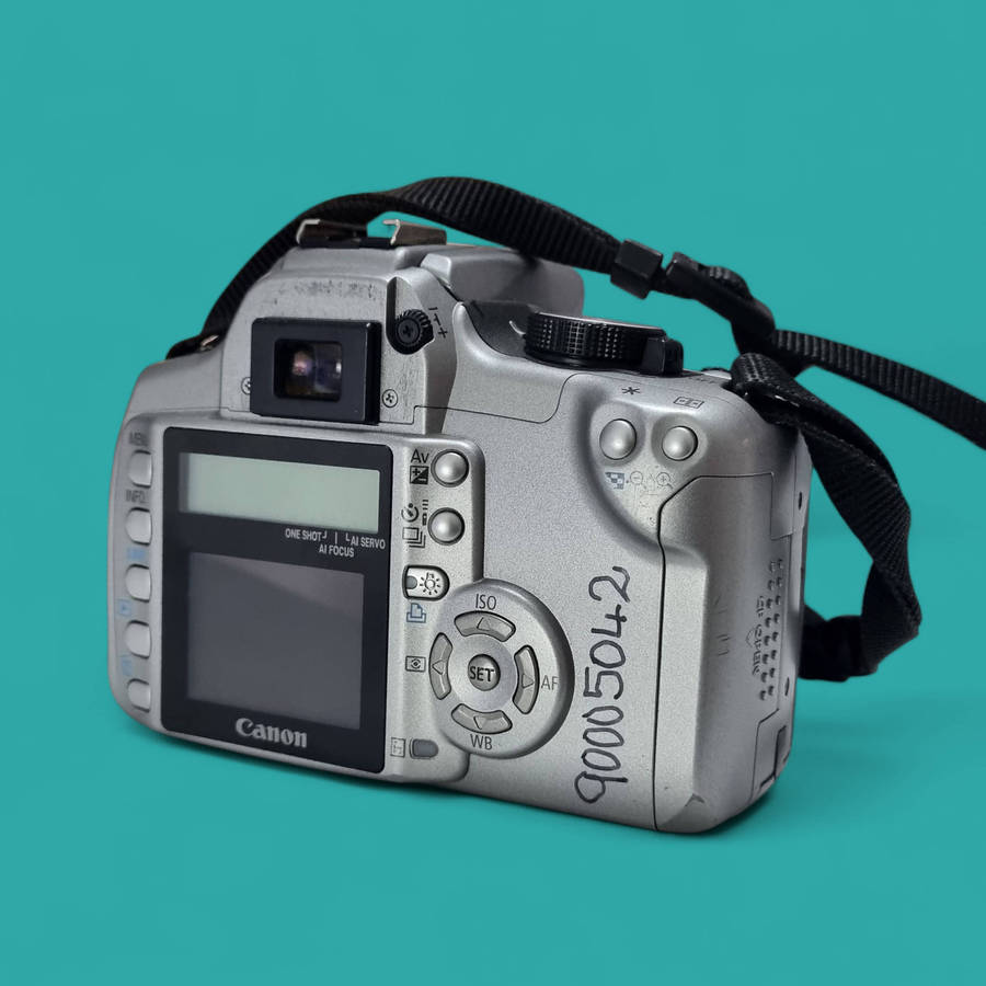Canon Dslr Camera with original charger, battery and Canon EF-S 1855mm f/3.55.6 kit lens.