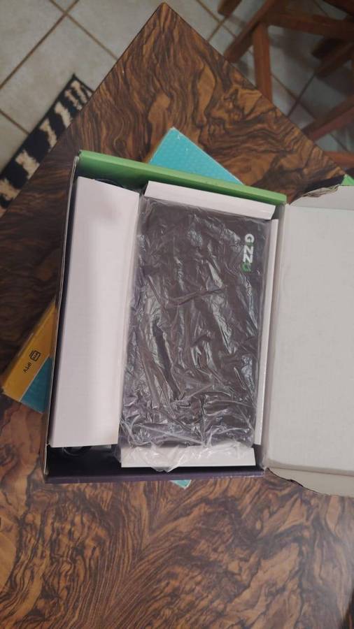 Gizzu Mini 8800MAH Dual- voltage DC UPS With a TP-Link 300 MBPS Wireless N Router
