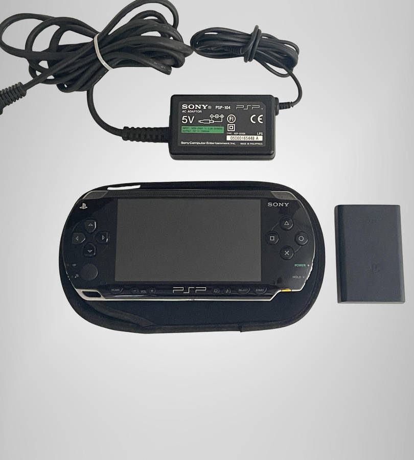 Sony PSP-1004 Portable Console | No Battery | Includes Charger, Sleeve & 8GB Memory Stick | Sold As
