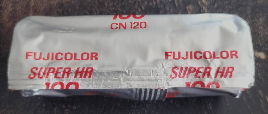 Unopened Fujicolor Super HR100 roll film spool