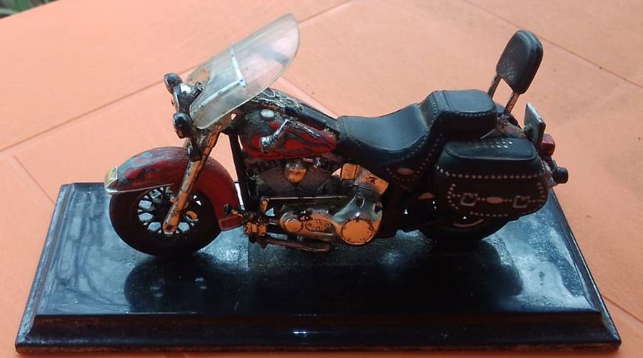 vintage Harley bike on stand.