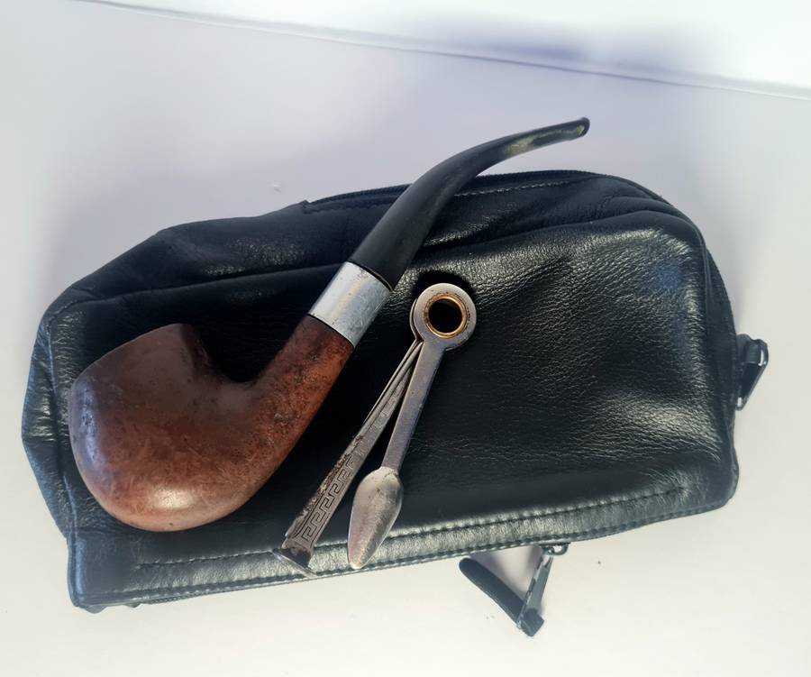 Smoking pipe, pipe cleaning tool and tobacco pouch.