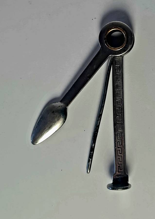 Smoking pipe, pipe cleaning tool and tobacco pouch.