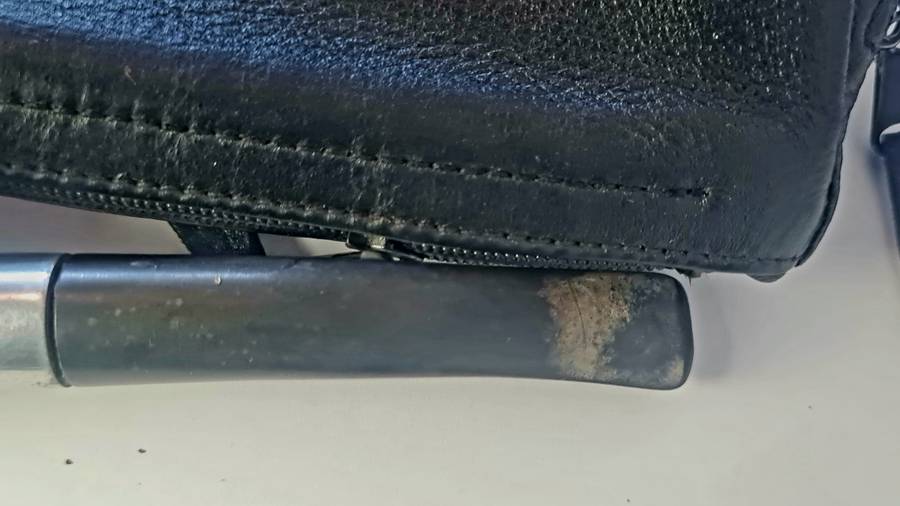 Smoking pipe, pipe cleaning tool and tobacco pouch.