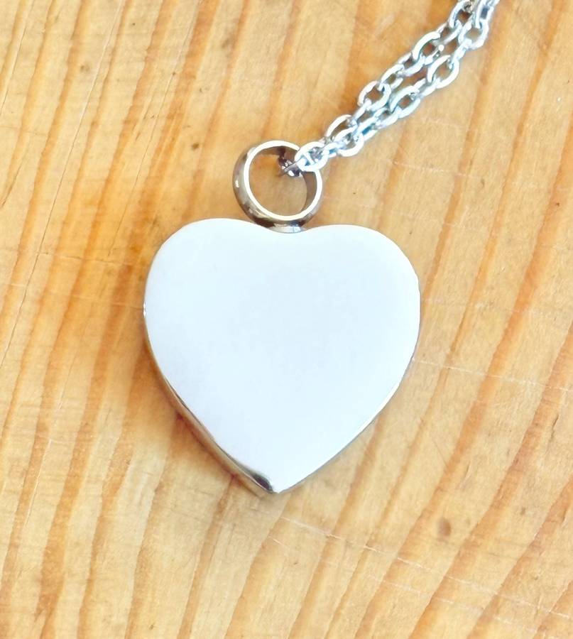 Keepsake urn pendant. Heart shaped, 4 paw prints. Stainless steel.