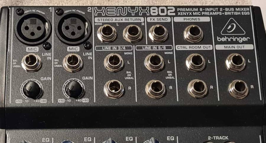 Behringer Xenyx 802 audio mixer. It's a compact, 8-input mixer.