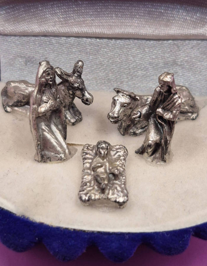 Miniature Nativity scene set in a velvet box.