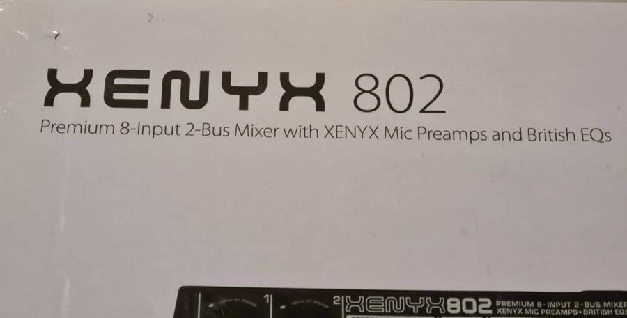 Behringer Xenyx 802 audio mixer. It's a compact, 8-input mixer.