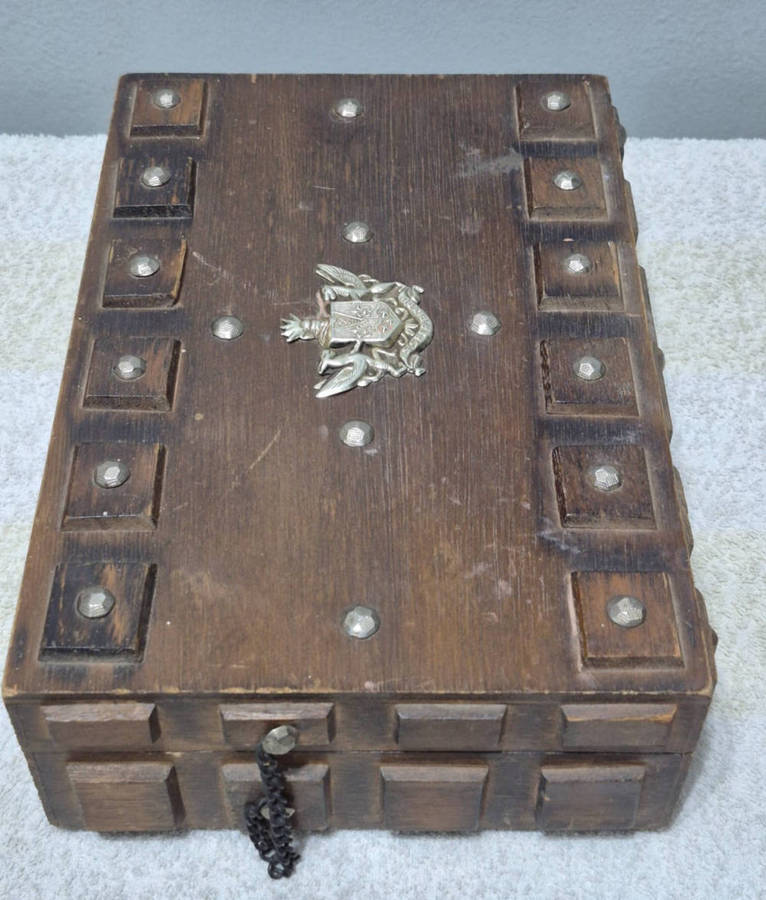 Vintage wooden jewelry box with a gothic or medieval aesthetic