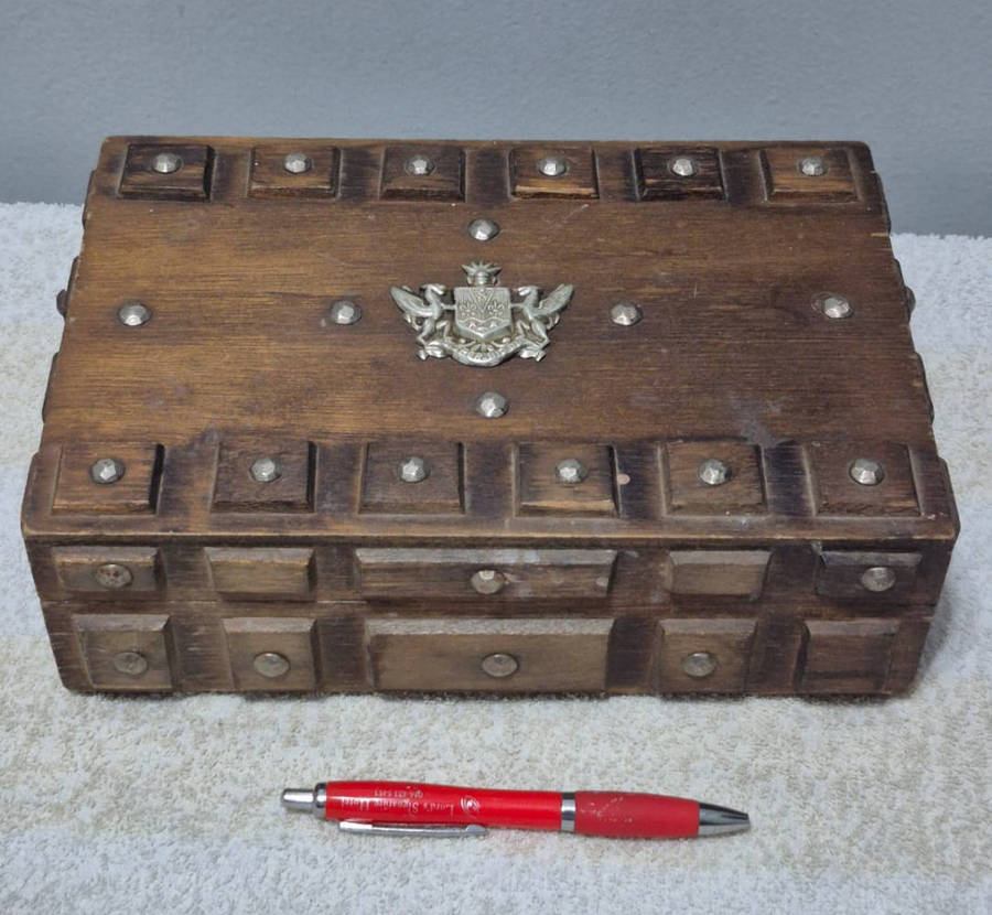 Vintage wooden jewelry box with a gothic or medieval aesthetic