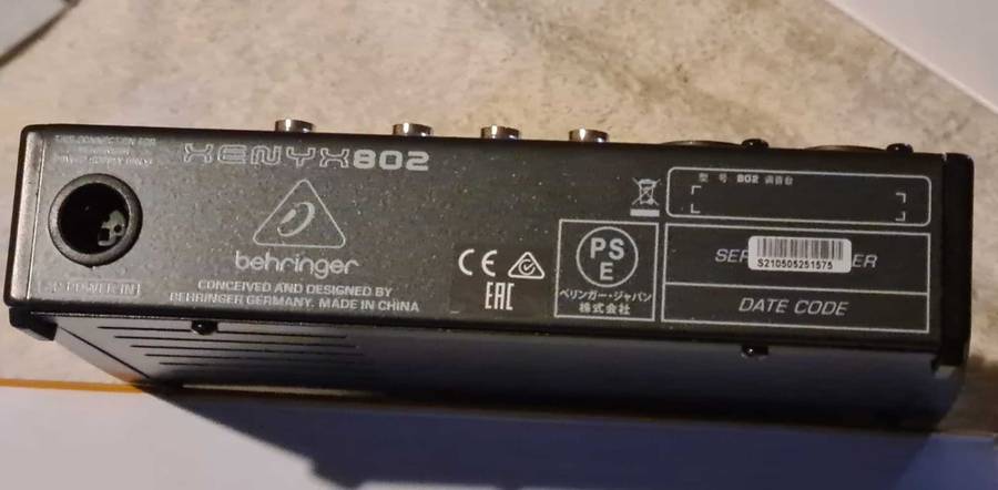 Behringer Xenyx 802 audio mixer. It's a compact, 8-input mixer.