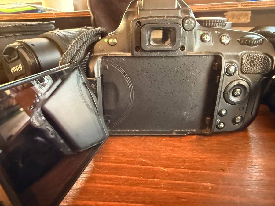 Nikon D5100 DSLR camera with 2 lenses, flash and spare batteries and charger