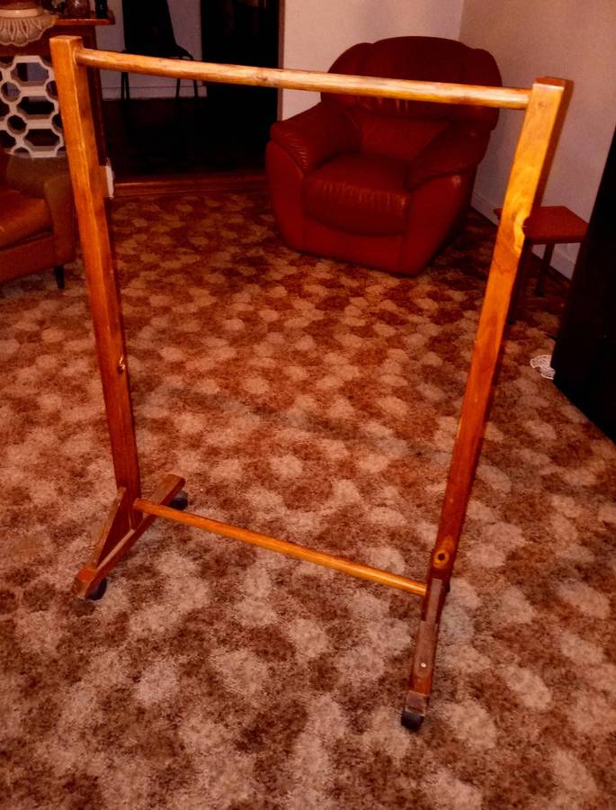 Wooden clothes rail with wheels