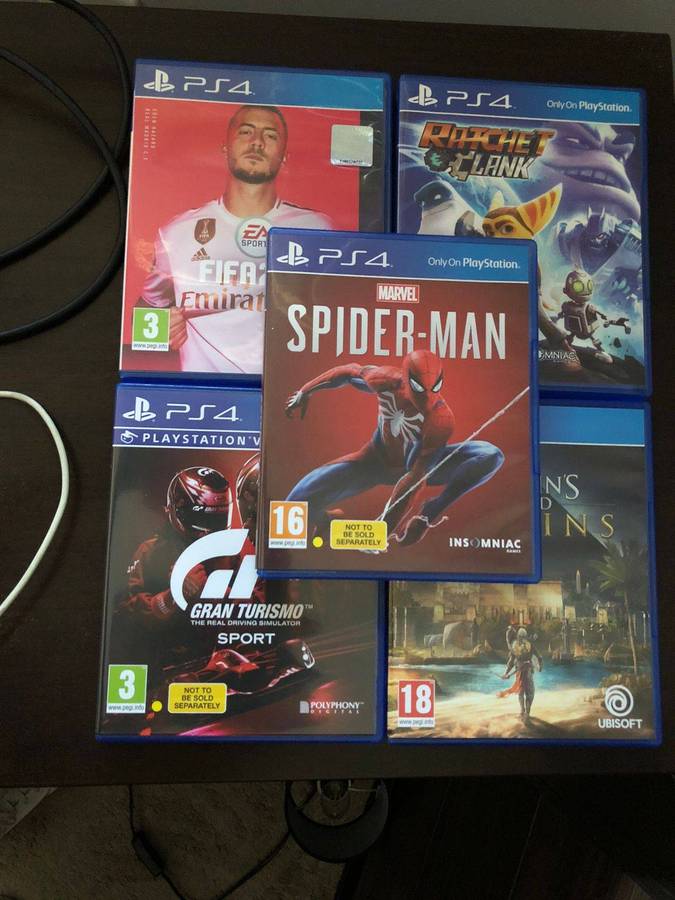 Sony PlayStation 4 with 5 Games and 24 Inch LED Monitor