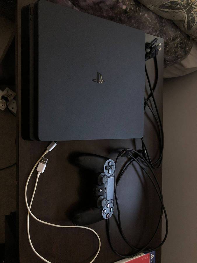 Sony PlayStation 4 with 5 Games and 24 Inch LED Monitor