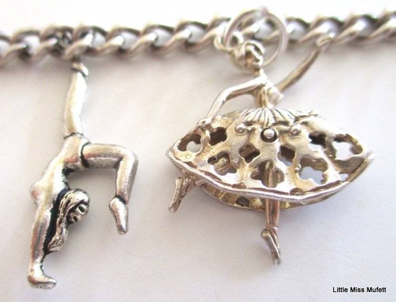 A Sterling silver charm bracelet with some interesting charms and a St. Christopher--21 Gram plus