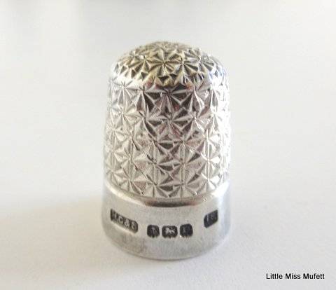 A Hallmarked silver sugar snipper and a Hallmarked silver thimble--Total weight 25 gram